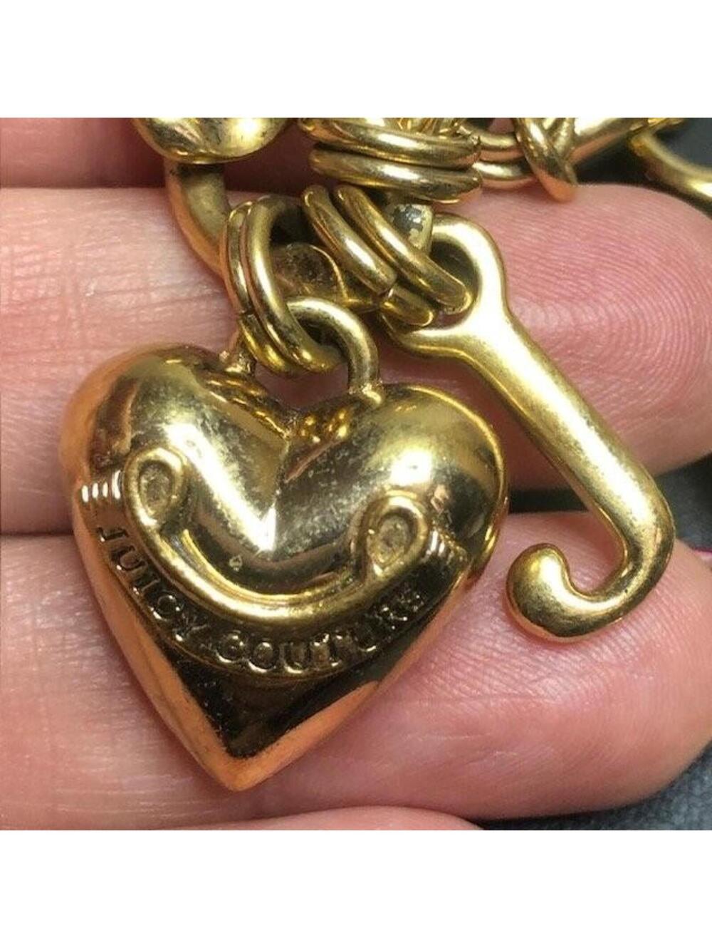 9693 Juicy Couture Gold Tone Logo Banner Heart J Charm Toggle Bracelet 7.5"